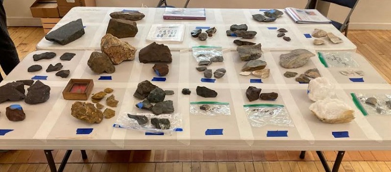 Table of hammerstones, worked flakes and debitage set up to give
                                          students a hands-on appreciation of what the different types of stonework actually look like.