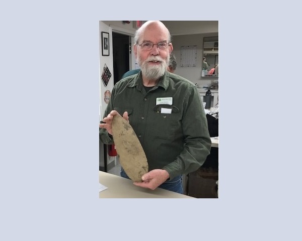 Craig Nelson with large chert biface - possibly a hoe or digging spade, from Indiana.  IAIS collection.