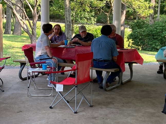 FOSA members sitting at a picnic table.
